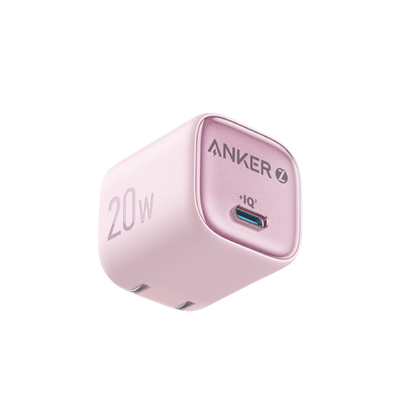 Pink Anker power adapter on a white background
