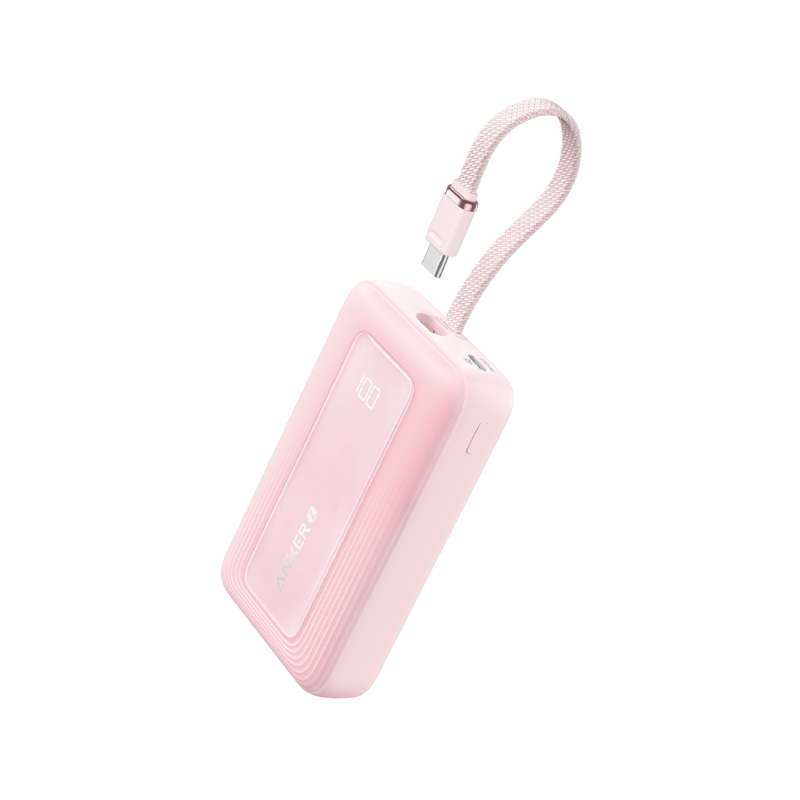 Pink portable device with a USB cable on a white background